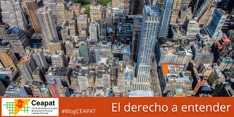 Vista aérea de la una ciudad con rascacielos y múltiples calles y cruces